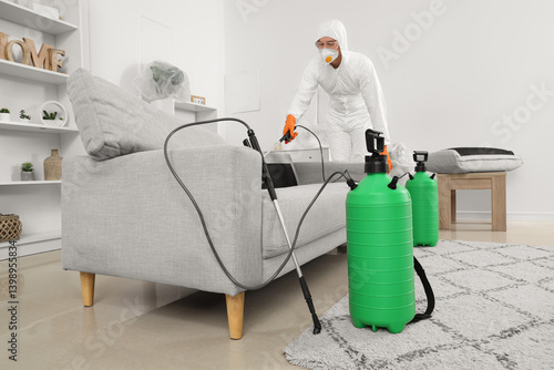 Male worker disinfecting so...