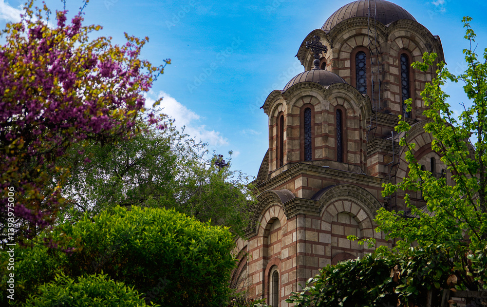 Fototapeta premium beautiful view of the old church nestled among the trees