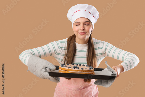 Female confectioner holding...