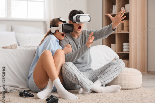 Scared young couple using V...