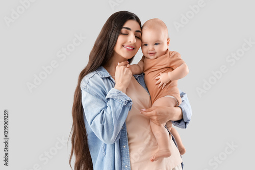 Happy young mother holding ...