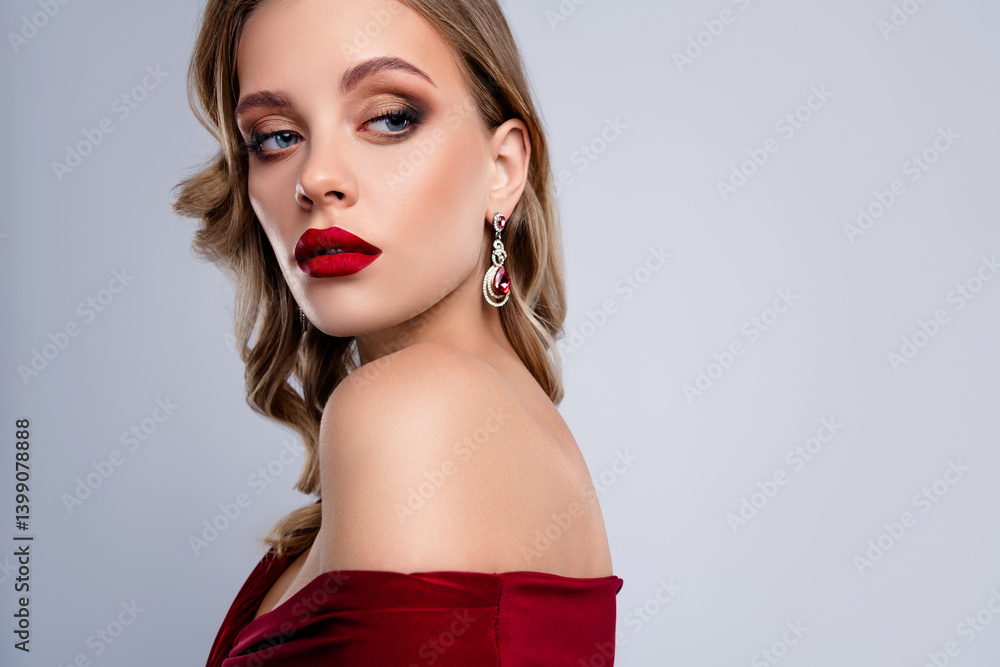 Pretty nice lady with bright make up red pomade looking on empty space grey background Pretty nice lady with bright make up red pomade looking on empty space grey background