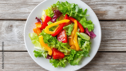 Fresh salad with vibrant bell peppers and mixed greens creates colorful and healthy dish, perfect for any meal