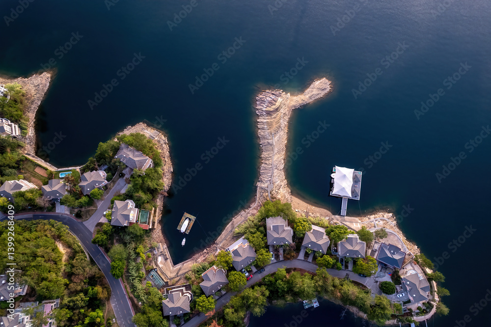 Scenic Aerial View of Luxury Lakefront Homes and Serene Waters