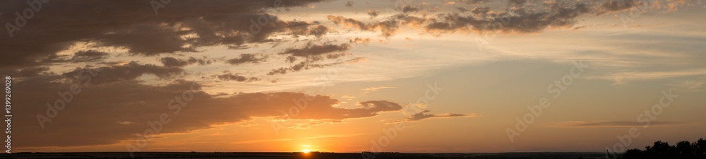 Landscape at sunset. Tragic gloomy sky. Panorama. Crimson twilight. Heavy, gloomy, dark clouds. Landscape at sunset. Tragic gloomy sky. Panorama. Crimson twilight. Heavy, gloomy, dark clouds.