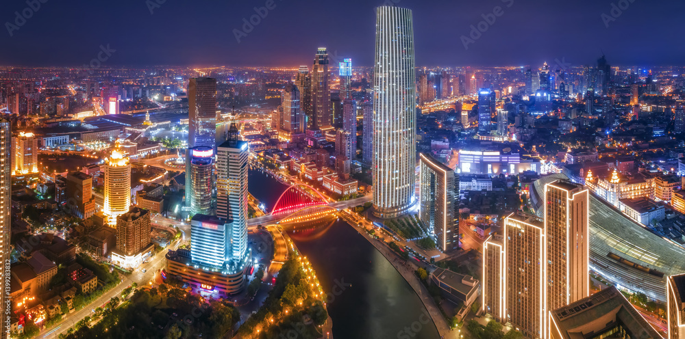 Stunning Night View of a Vibrant Urban Skyline with Illuminated Buildings