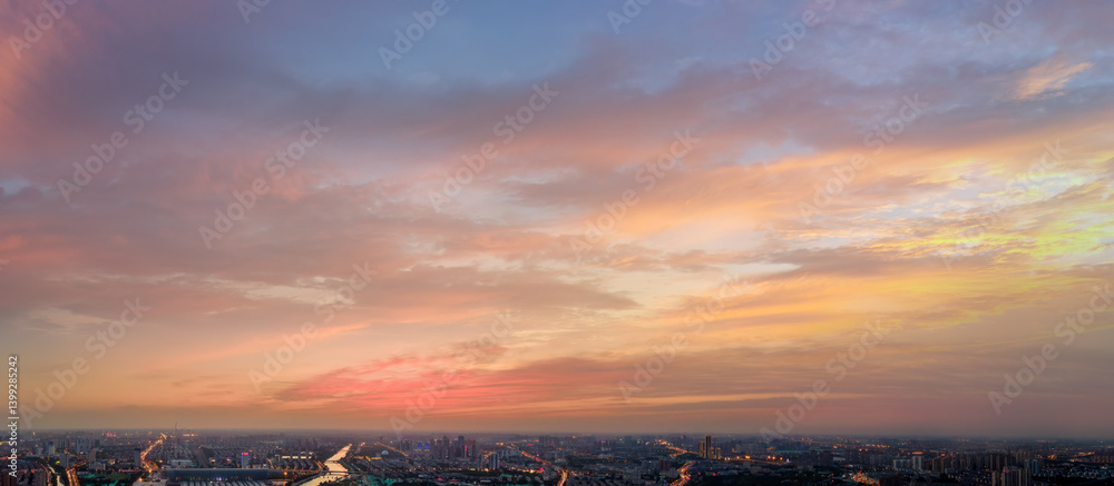 Breathtaking Sunset Over Urban Landscape with Colorful Skies