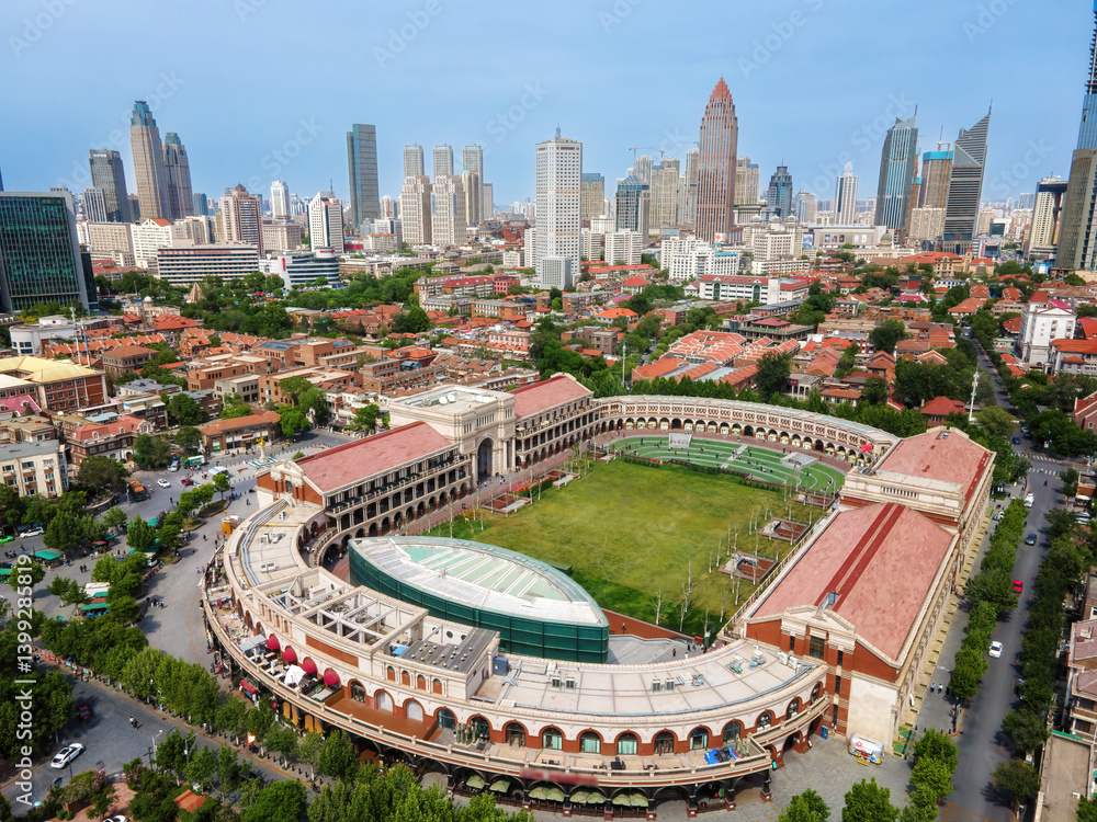 Aerial View of Urban Landscape Featuring Historic Stadium and Modern Architecture