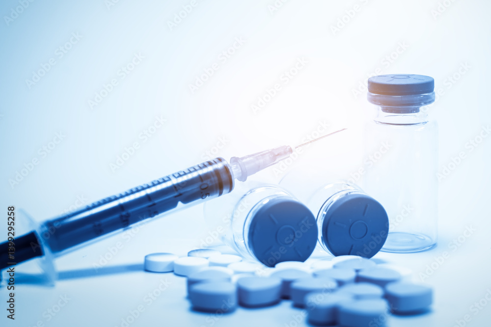 Medical Essentials: Syringe, Vials, and Tablets for Health Care