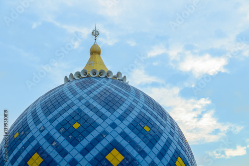 a blue dome of the mosque with a clear sky background. Muharram and ramadhan concept.