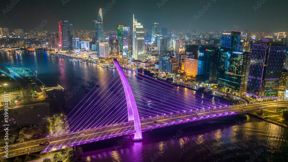 Aerial view of Ba Son Bridge at night in downtown Ho Chi Minh City, Vietnam, connecting District 1 and Thu Duc district