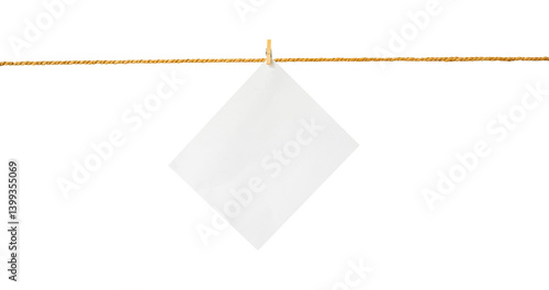 Photos blank white paper on rope isolated on white