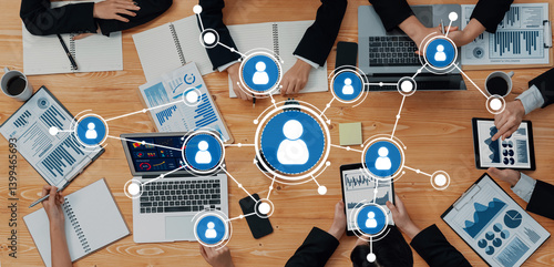 Obraz na płótnie A dynamic business meeting scene showcasing technology and networking elements, where diverse professionals collaborate over laptops and presentations, enhancing productivity. Amity w salonie