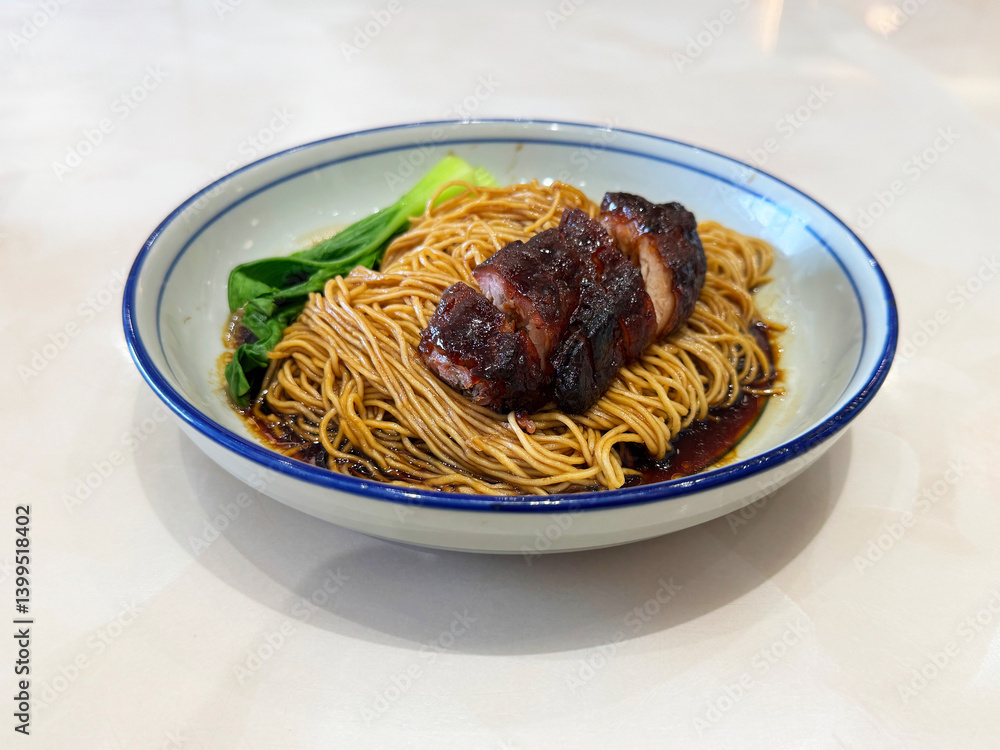 chinese cook hong kong dry wanton roasted bbq char siew meat yellow egg noodle mee in dark soy sauce in plate on white marble table asian restaurant halal food cafe menu