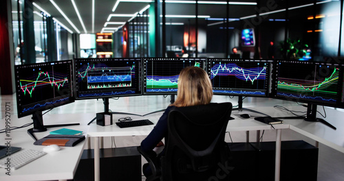 Obraz na płótnie Young Female Stock Market Analyst Reviews Multiple Computer w salonie
