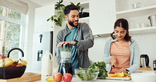 Home, blender and couple with smoothie, vegetables and balance with gut health, smile and bonding together. Kitchen, people and man with woman, nutrition and wellness with detox, breakfast and diet