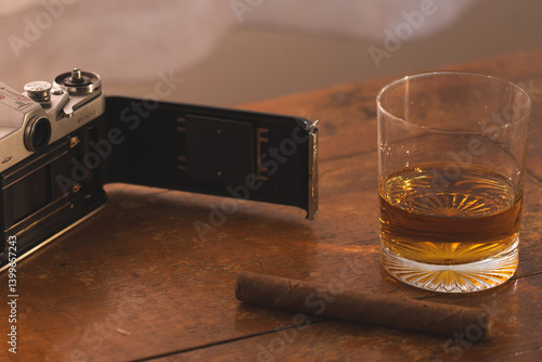 Open vintage Film Camera with Drink and Tobacco