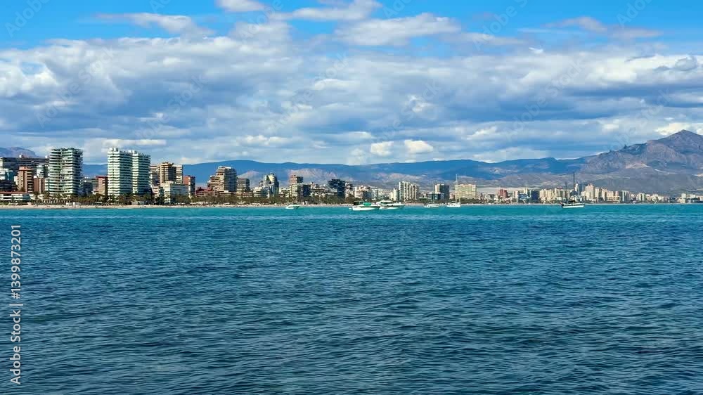 This coastal scene features a stunning skyline and majestic mountains, ideal for inspiring travel content This coastal scene features a stunning skyline and majestic mountains, ideal for inspiring travel content