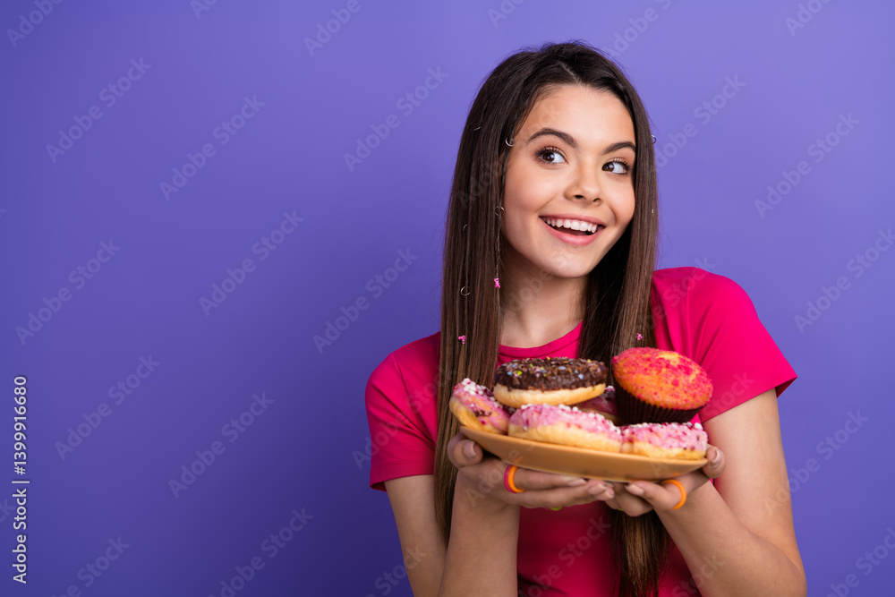 Young beautiful woman holding a plate of colorful donuts while smiling on a vibrant purple background Young beautiful woman holding a plate of colorful donuts while smiling on a vibrant purple background
