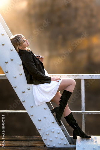 Young woman on the bridge