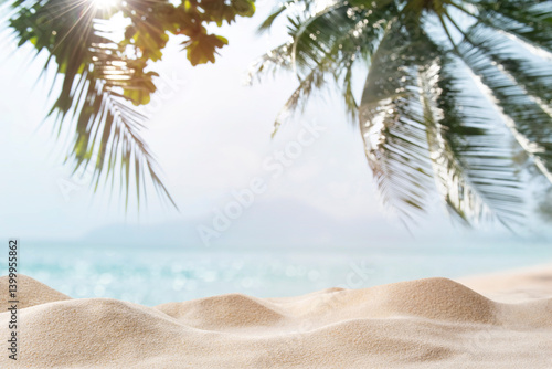 Fototapeta Naklejka Na Ścianę i Meble -  Summer sand beach with tropical sea, palm leaves and sunlight in the background