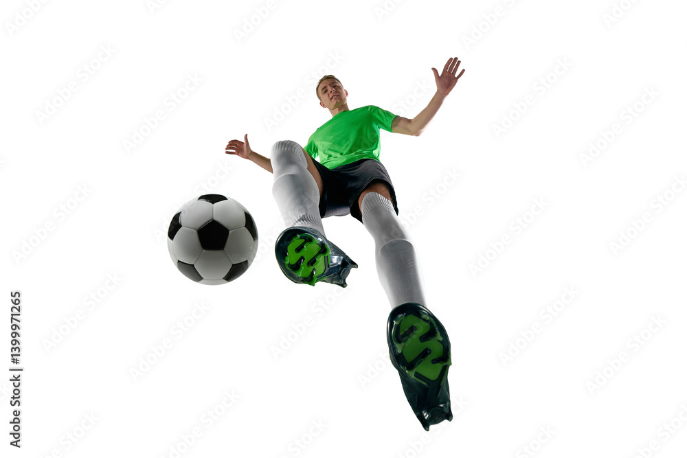 Low angle of focused man, dressed sport uniform, soccer player dribbling fast with intensity against white studio background. Concept of professional sport, training, tournament, energy. Ad