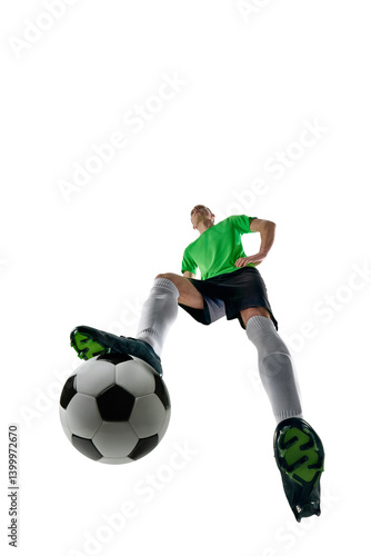 Obraz na płótnie Low angle of skilled man, dressed sport uniform, soccer player preparing long pass in motion against white studio background. Concept of professional sport, training, tournament, energy. Ad w salonie