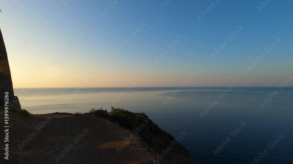 Sunrise over Mediterranean sea. Historic Torre, a watchtower looking out for any marauding pirates. La Herradura, Andulasia, Southern Spain Sunrise over Mediterranean sea. Historic Torre, a watchtower looking out for any marauding pirates. La Herradura, Andulasia, Southern Spain