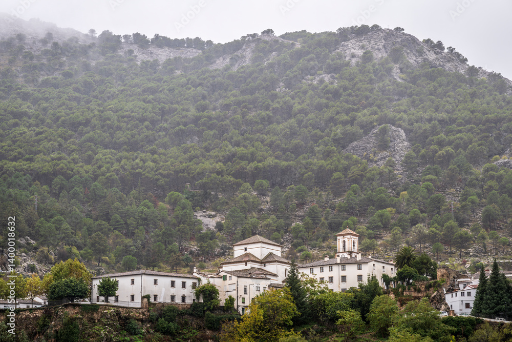 Obraz premium traditional Spanish architecture, nestled into the Anadlusian hills, on a rare rainy day in southern Spain