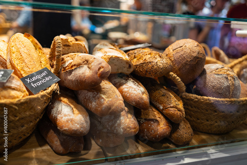 Obraz na płótnie Assorted bread arranged on tray selling at bakery shop. Morning breakfast with fresh breads w salonie