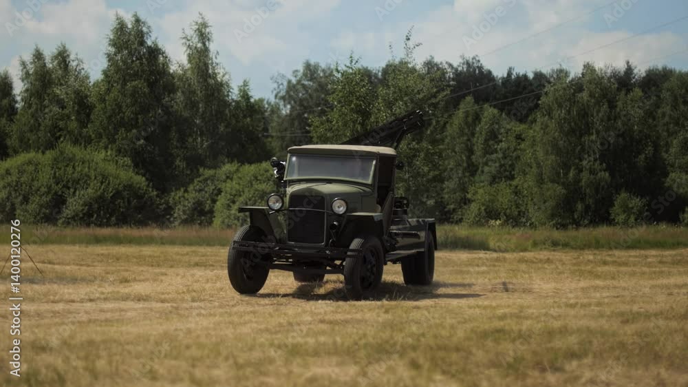Soviet Katyusha multiple rocket launcher Vehicle drives across field in Great Patriotic War Reenactment. legendary Red Army rocket artillery system military vehicle. Iconic BM-13 mounted on truck Soviet Katyusha multiple rocket launcher Vehicle drives across field in Great Patriotic War Reenactment. legendary Red Army rocket artillery system military vehicle. Iconic BM-13 mounted on truck
