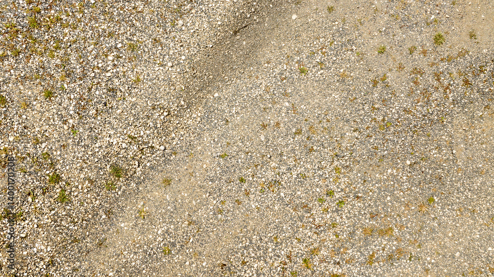 Aerial view perpendicular to rugged terrain with pebbles. ideal for texture, pattern and background