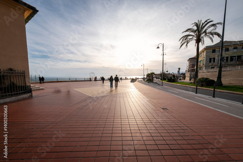 Springtime sunset over the Ligurian sea, taken from one sea promenade at the eastern neighborhoods of the city of genoa (ligurian region, northern italy).