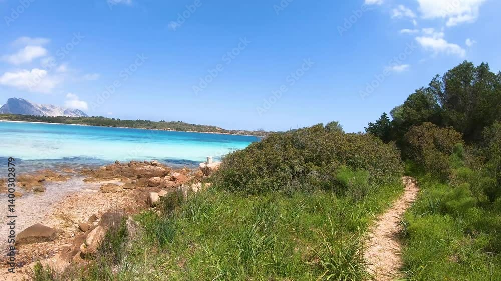 First person view of a walk by the sea in Cala Brandinchi. Sardinia, Italy First person view of a walk by the sea in Cala Brandinchi. Sardinia, Italy