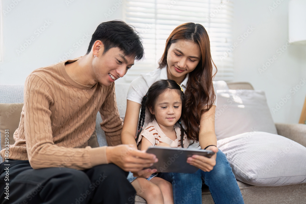 Family Time and Learning Together. A family shares a delightful moment watching a tablet, engaging in educational activities. Family Time and Learning Together. A family shares a delightful moment watching a tablet, engaging in educational activities.