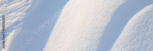 Obraz na płótnie Snow texture. Wind sculpted patterns on snow surface. Wind in the tundra and in the mountains on the surface of the snow sculpts patterns and ridges. Arctic, Polar region. Winter panoramic background. w salonie