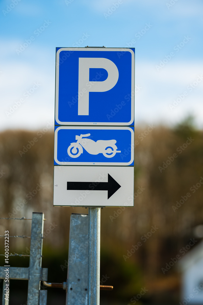 Motorcycle parking sign with direction arrow. Motorcycle parking sign with direction arrow.