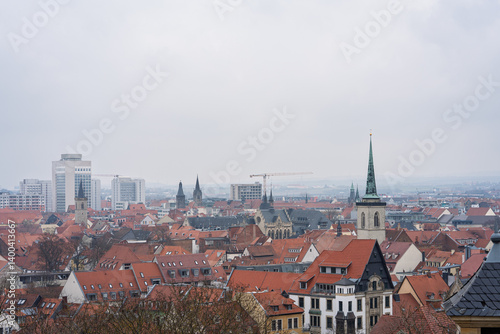 Wallpaper Mural Elevated View of Erfurt with Church Spires and Rooftops on a Cloudy Day, Germany, Erfurt, Mar-15-2025 Torontodigital.ca