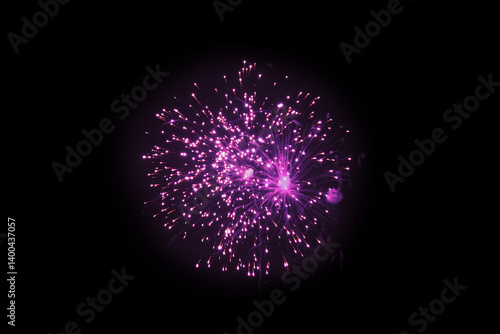 Fototapeta Naklejka Na Ścianę i Meble -  Purple Firework Explosion Against Dark Night Sky