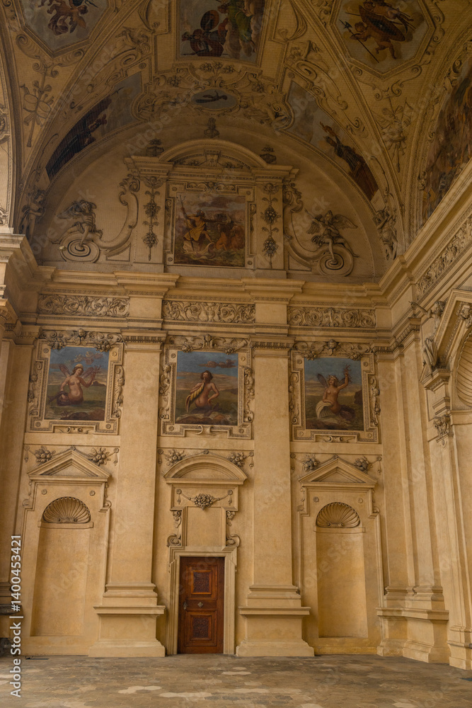 Close-up of beautifully painted frescoes on the walls of an ancient building, showcasing intricate details of historical art. The vibrant colors and craftsmanship highlight the cultural heritage.