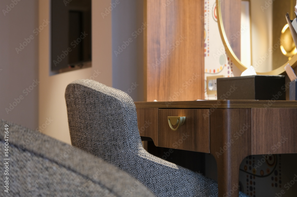 Luxurious mini suite stateroom cabin room onboard luxury cruise ship cruiseship ocean liner with bedroom and living area in red and creme with wood in modern Art Deco interior design