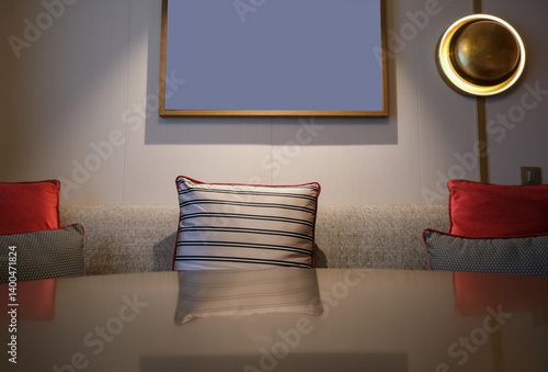 Obraz na płótnie Luxurious mini suite stateroom cabin room onboard luxury cruise ship cruiseship ocean liner with bedroom and living area in red and creme with wood in modern Art Deco interior design w salonie