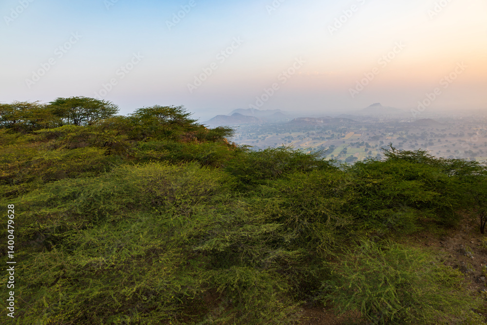 Sunrise landscape over a green mountainous sector of the Jaipur outskirts, Rajasthan, India Sunrise landscape over a green mountainous sector of the Jaipur outskirts, Rajasthan, India