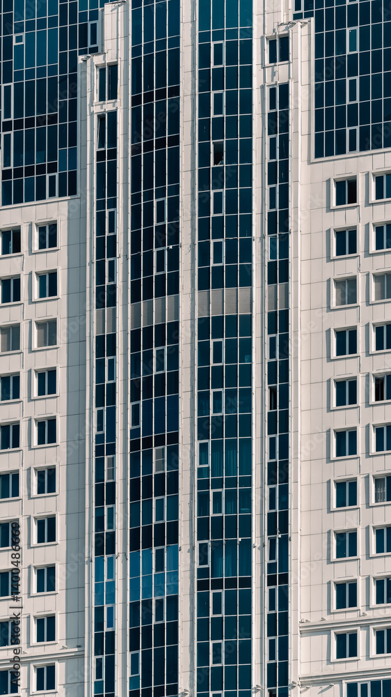 many windows and walls facade of a modern skyscraper without people many windows and walls facade of a modern skyscraper without people