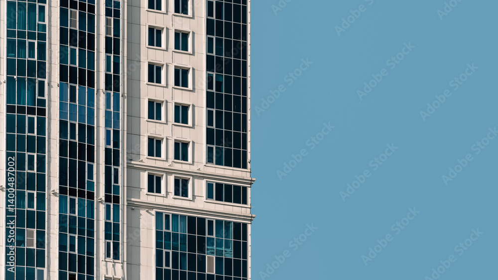 Fototapeta premium many windows and walls facade of a modern skyscraper without people