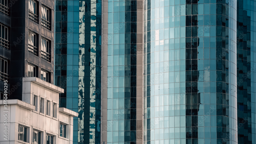 Fototapeta premium many windows and walls facade of a modern skyscraper without people