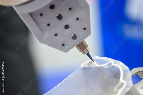 The glue sealing process on automotive parts by robotic system.