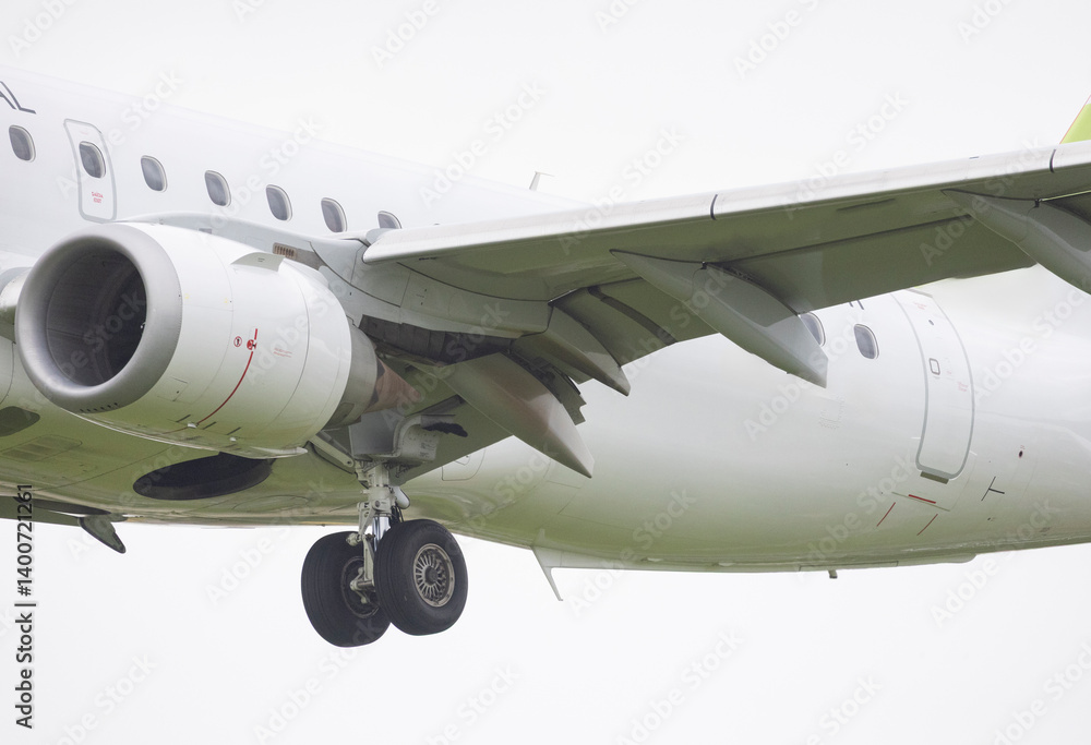 Modern passenger airplane taking off or landing at airport Modern passenger airplane taking off or landing at airport