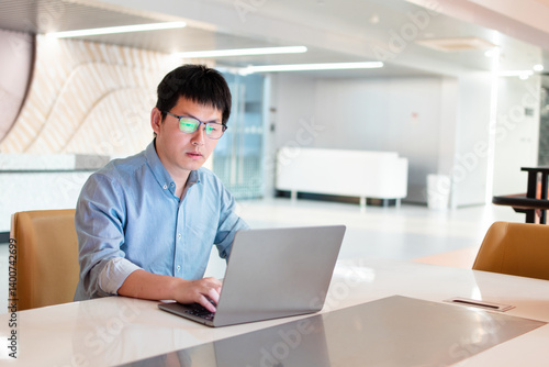 Wallpaper Mural asian businessman working on laptop Torontodigital.ca