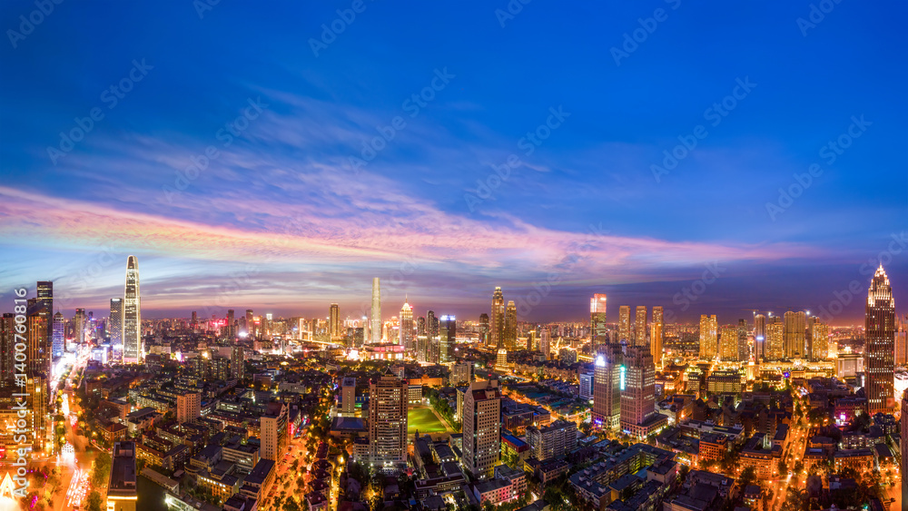 Fototapeta premium Vibrant Cityscape at Dusk: A Panoramic View of Urban Life